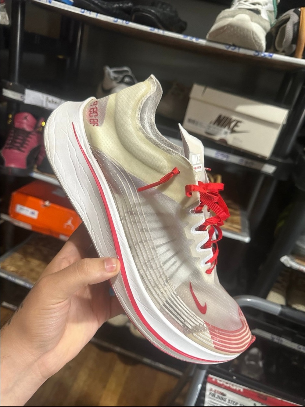 Nike White Running Shoe with Red Accents